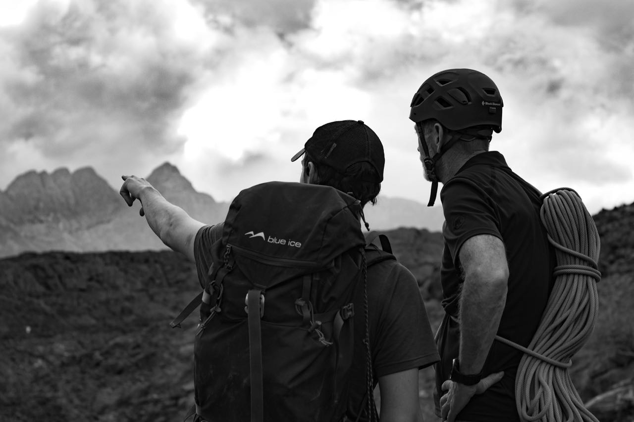 Climbing - 2 people looking at mountains leadership