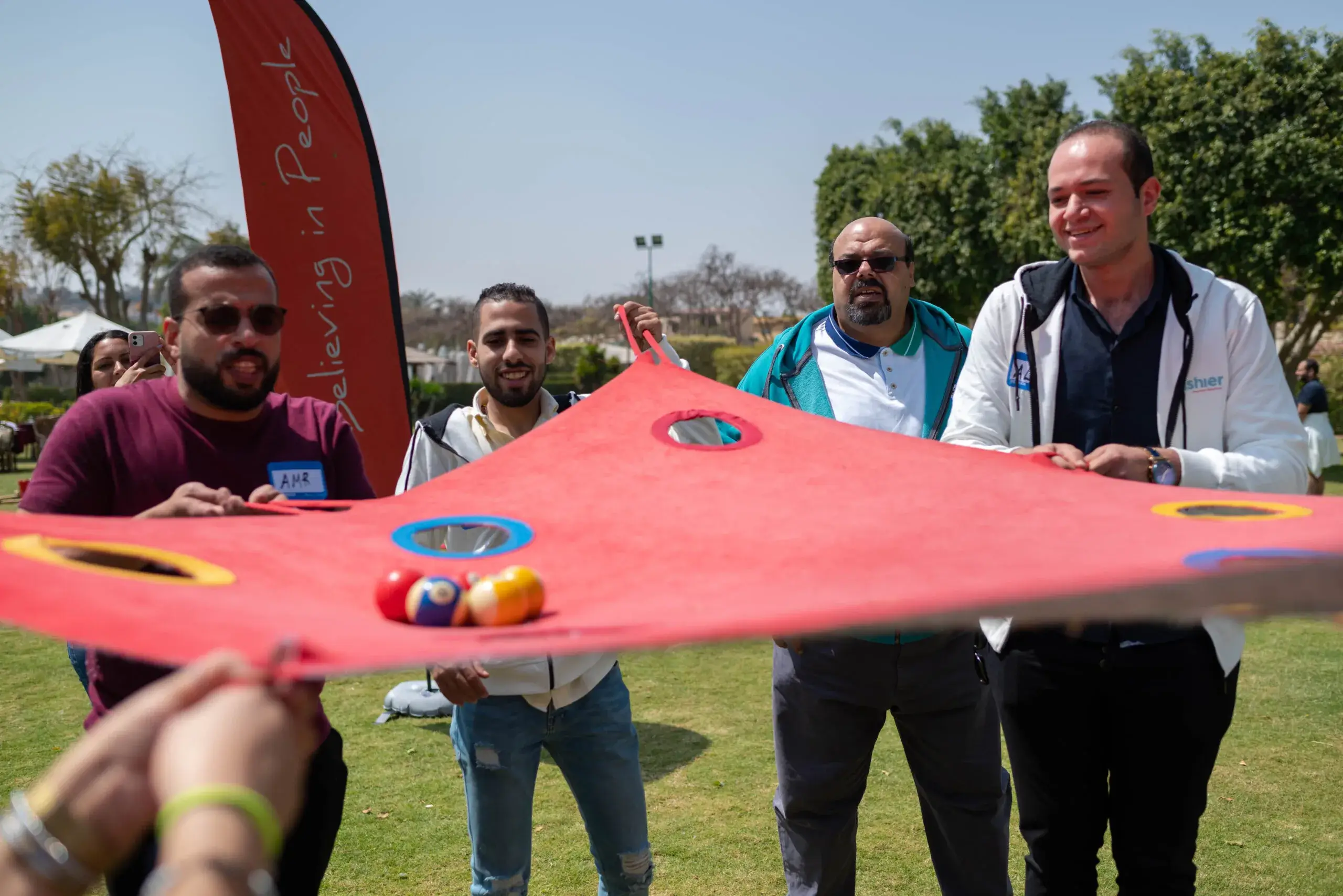 group of people playing a team building game